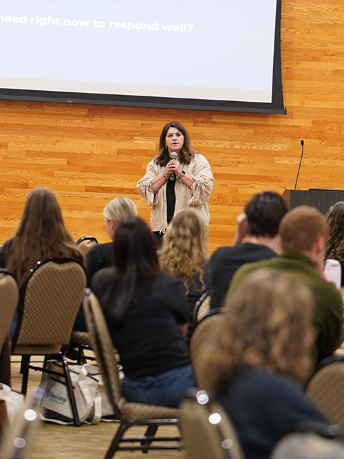 Julieta speaking at event